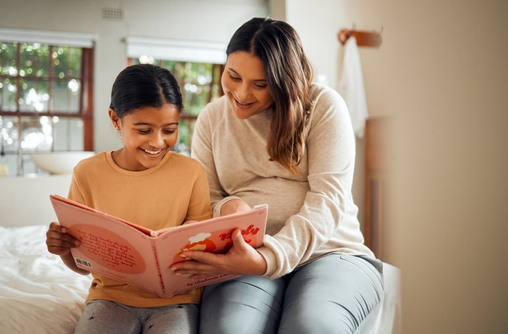 Mother and daughter reading together